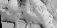 Layered mesas, as seen by HiRISE under HiWish program.  Dark slope streaks are also visible.