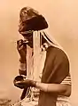 A witch doctor taking snuff. Alfred Duggan-Cronin. South Africa, early 20th century. The Wellcome Collection, London