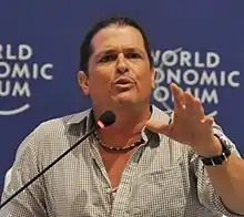 Carlos Vives, speaking.