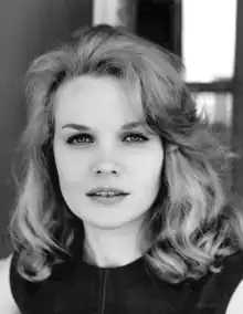 A black-and-white headshot of Carroll Baker