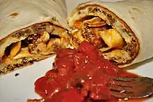 A chorizo-and-egg breakfast burrito with salsa