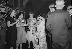Picture of a group of people attending a cocktail party.
