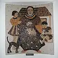 Mosaic commemorating the 1935 expansion illustrating the "ideal housewife" with two children, a house and a cat, by glass-artist Femmy Schilt-Geesink