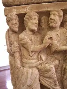 Image 15Detail of the earliest known artwork of the Trinity, the Dogmatic or Trinity Sarcophagus, c. 350 (Vatican Museums)Three similar figures, representing the Trinity, are involved in the creation of Eve, whose much smaller figure is cut off at lower right; to her right, Adam lies on the ground (from Trinity)