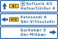 Destination ahead (a) with distances in capital area