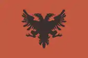 Illustration of the flag found on the cover page of the 7th issue of Zër' i Popullit newspaper, dated 17 December 1912.