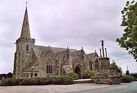 Photograph of a granite church with a gabled facade