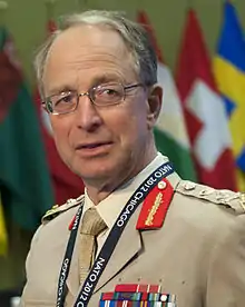 An officer in warm-weather uniform