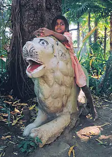 Image 15A girl in Udaipur playing "Jungle Child" (from Girls' toys and games)