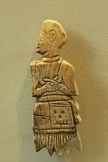 Shell inlay in the name of Akurgal (on the skirt, vertically), found in Girsu. Louvre Museum