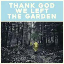 The title in white text against a blue background above an otherwise black-and-white photograph of two people walking in a forest wearing yellow clothes, showing one tree with green leaves