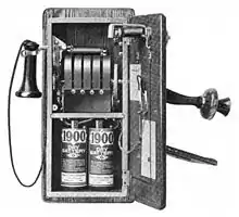 Image 241917 wall telephone, open to show magneto and local battery (from History of the telephone)