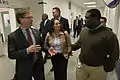 John Walsh (left) and Lisa Posthumus Lyons (middle) speak with JaHaun McKinley (right) of Cascade Engineering.