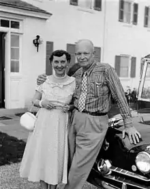 Dwight with his arm around Mamie, both in casual wear