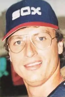 A man in a navy baseball cap
