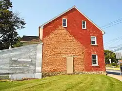 The house's "shadow" on the building at 204 W. Main