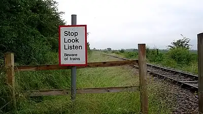 Stop Look Listen Beware of Trains sign near Fenny Compton Junction. This crossing is a foot crossing, one of the most common in the United Kingdom