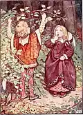 A little boy grabs foliage from a tree branch as a little girl watches