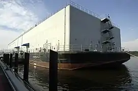 APL-61, a non self-propelled barracks ship and lead ship of her class, moored alongside the United States Naval Academy
