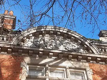 Terracotta wall decoration with swags